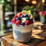 Chia breakfast pudding topped with berries and banana slices